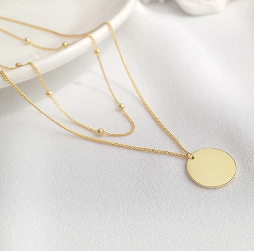 Double layer disc necklace in gold Endless Stories
